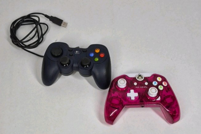Lot of 2 Game Controllers Xbox Style Pink Wired Logitech Black USB