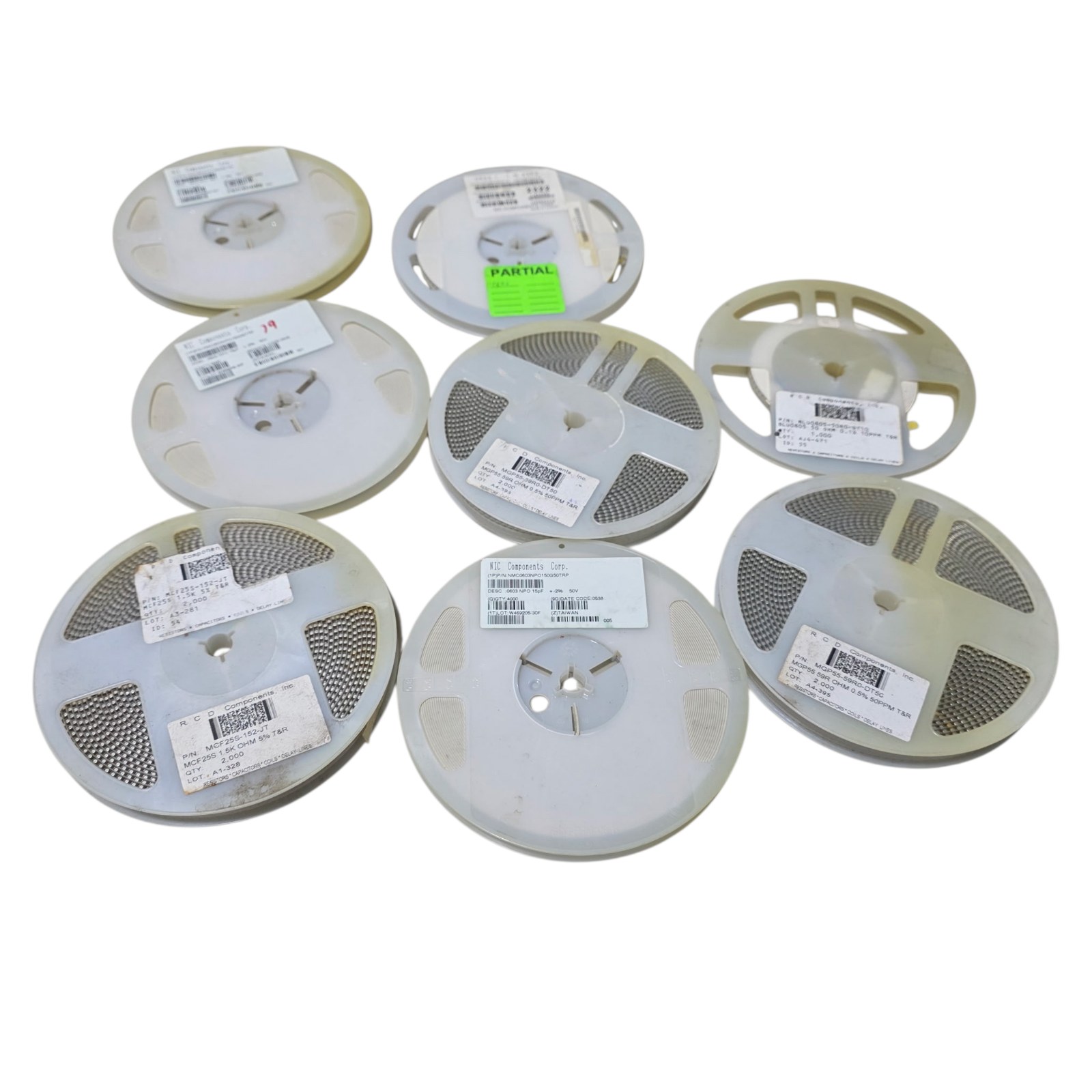 Mixed Lot of 8 New Surplus Component Reels - NIC Capacitors and Chip Resistors - Partial Included