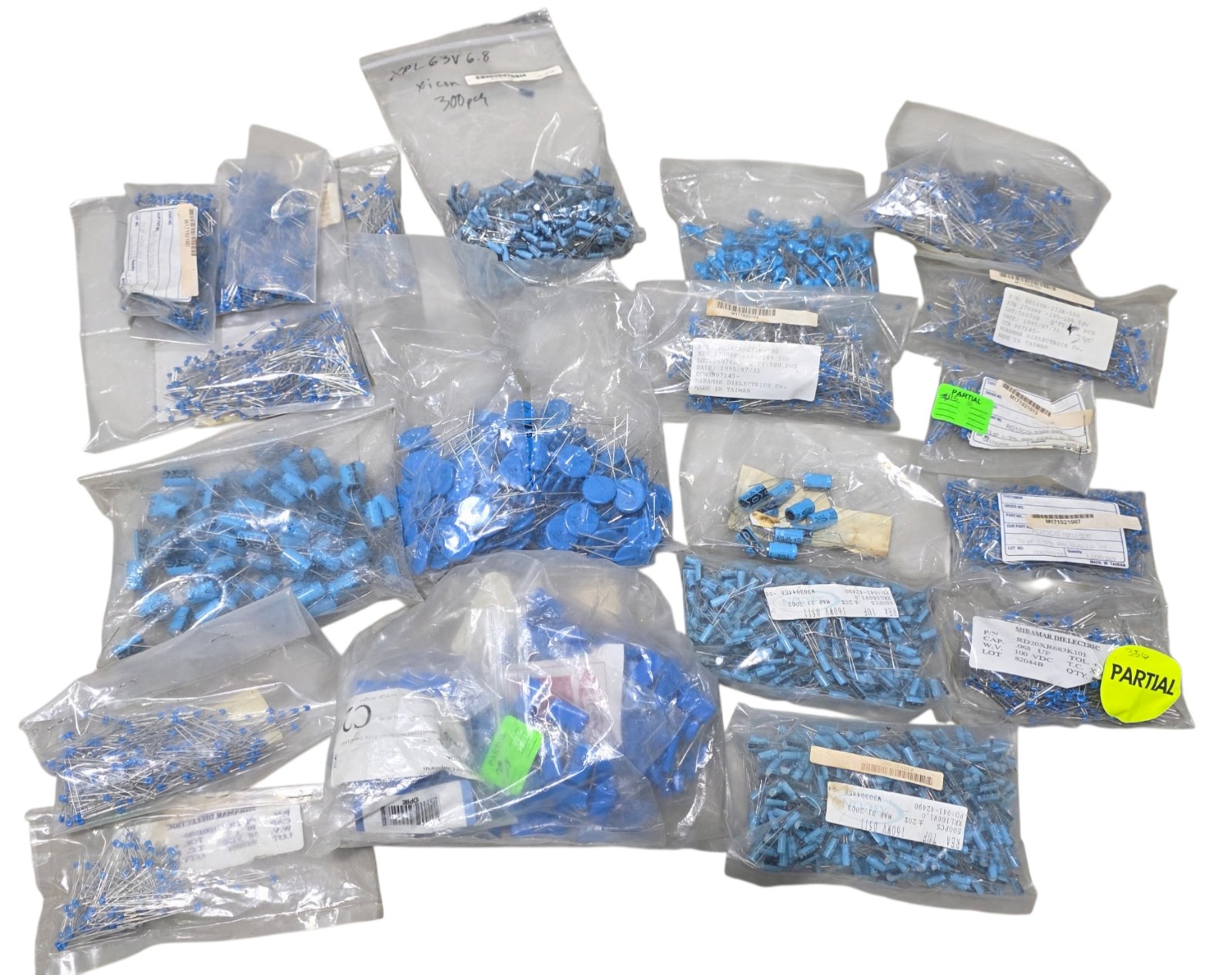 Mixed Lot of Nos Surplus Capacitors - REA, Miramar Dielectric, COG Ceramic and Electrolytic Components - Partial Bags Included