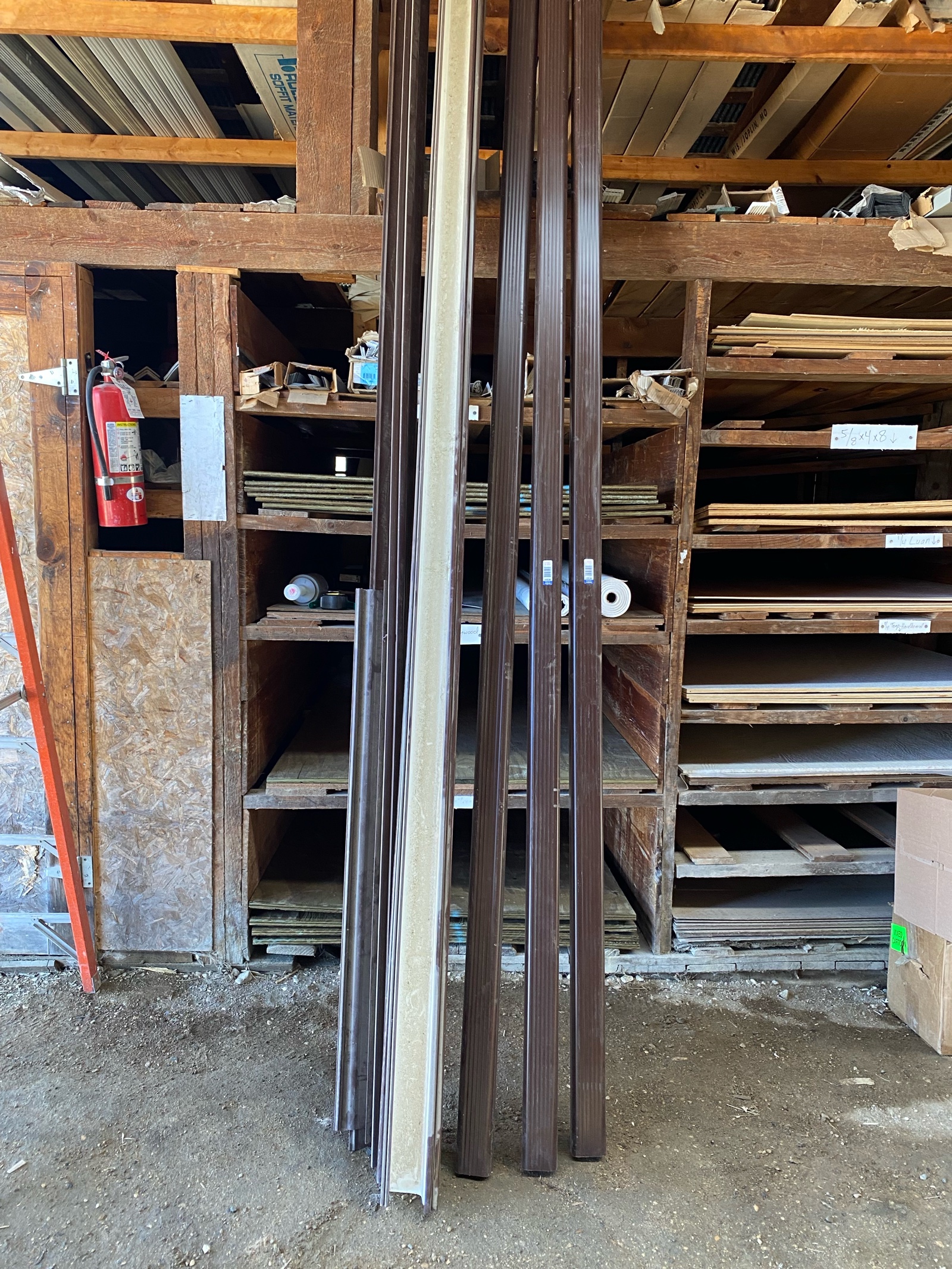 brown plastic gutter and down spout