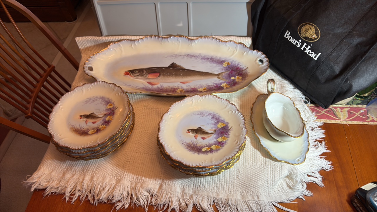 Limoge china set with handpainted fish motif