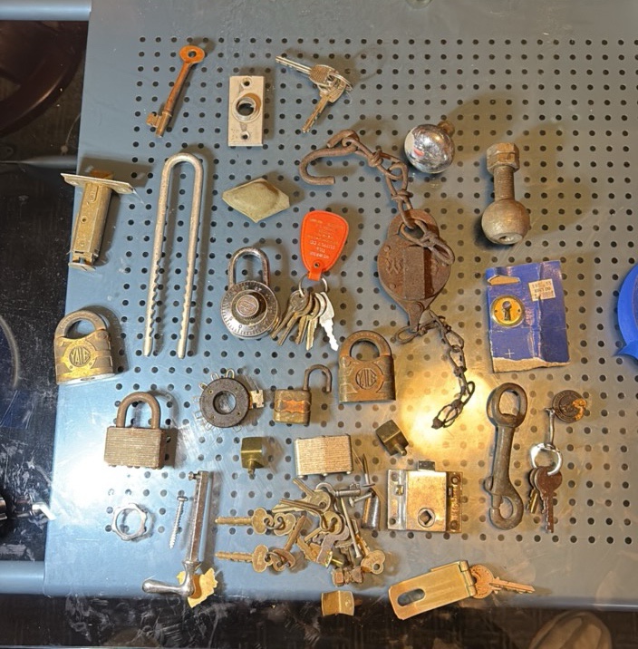 Assorted metal items. brass locks and keys etc.