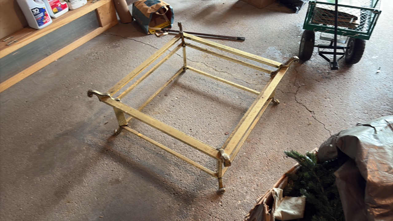 Brass Table with scroll finials and Glass Top.