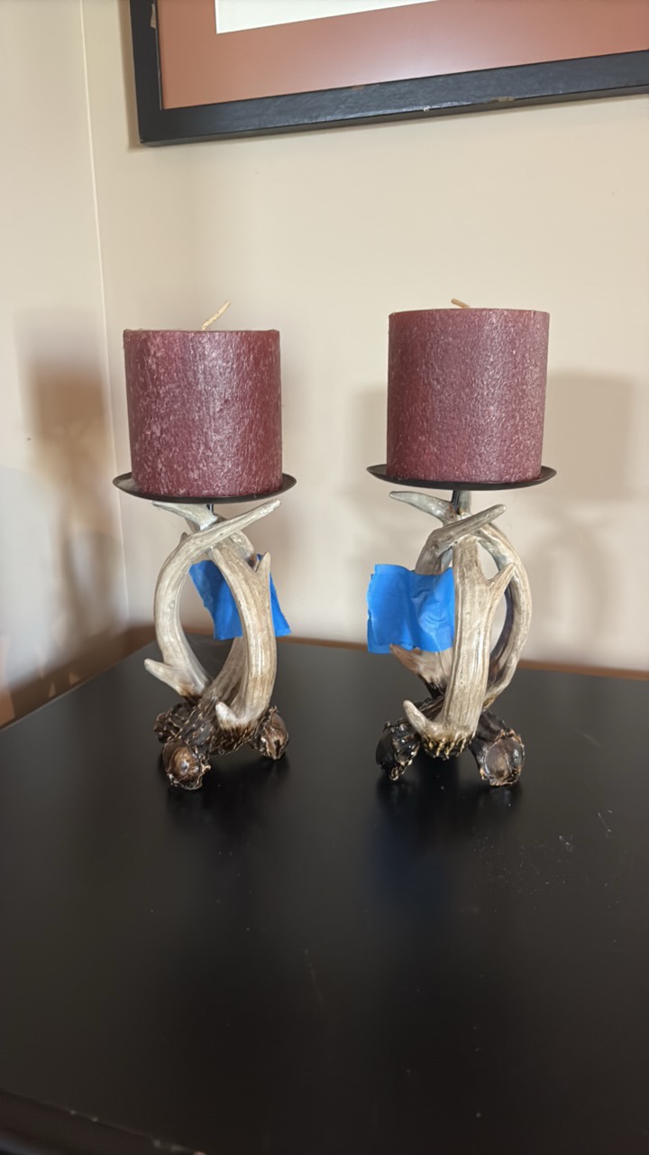 (2) Antler pillar candle holders with candles.