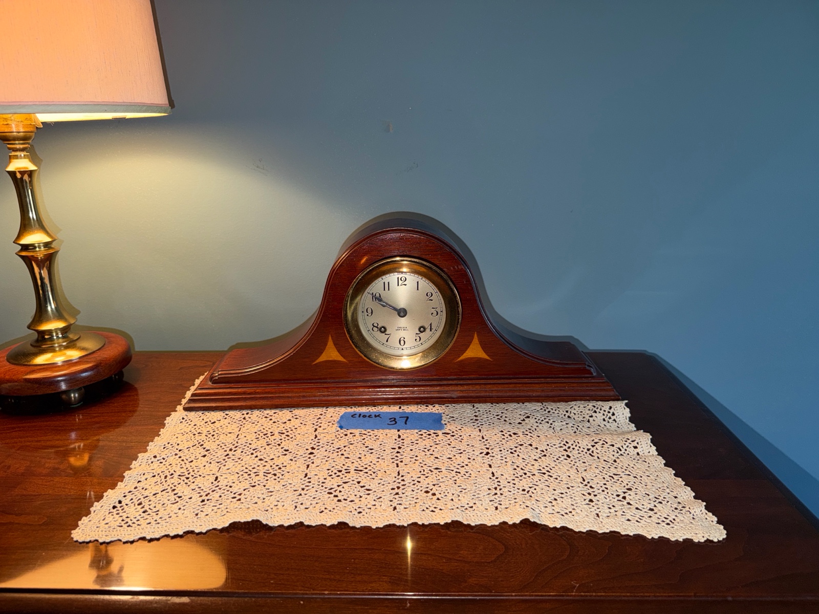 Chelsea Clock Ships Bell in wood case plus a lace doily