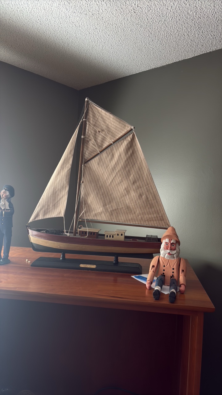 Mariner shelf-sitter and model of circa 1897 ship
