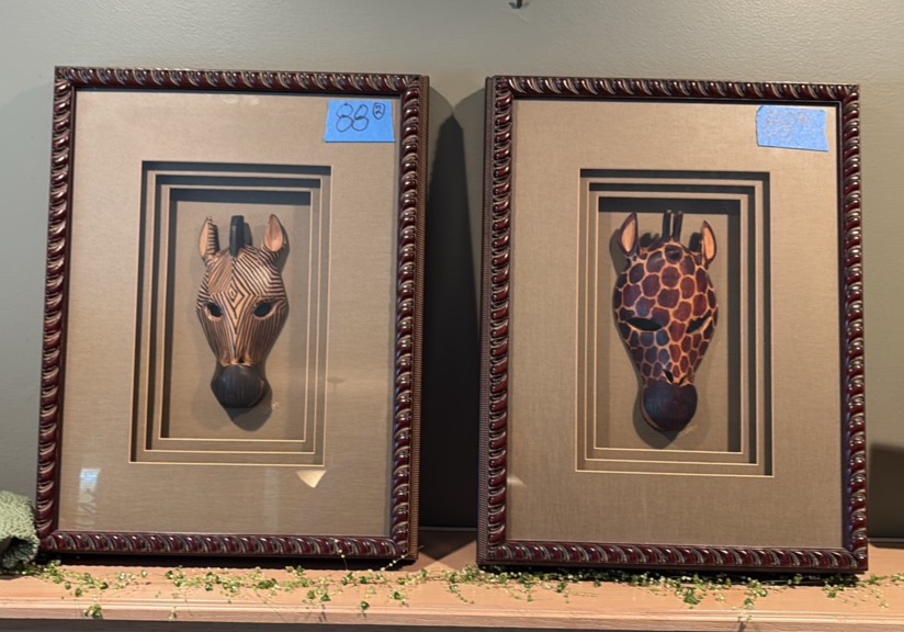 Giraffe and Zebra Masks in framed shadow boxes