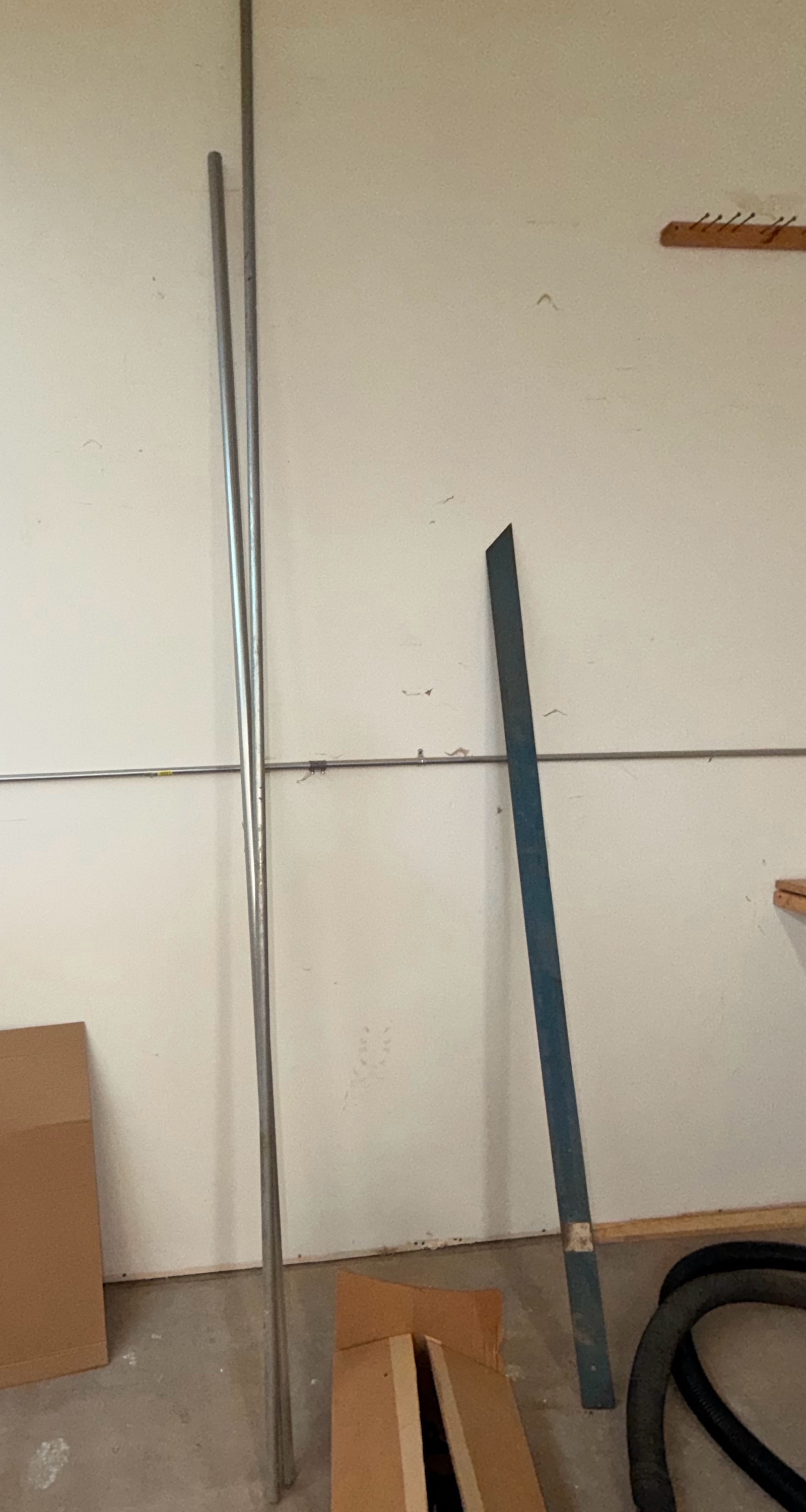 Electrical Conduit (metal conduit pipe) & framing piece.