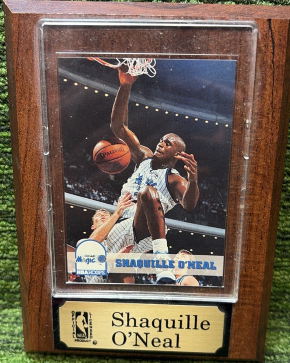Shaq plaque. SHAQUILLE ONEAL ROOKIE CARD, mounted onto wood, and under plastic.