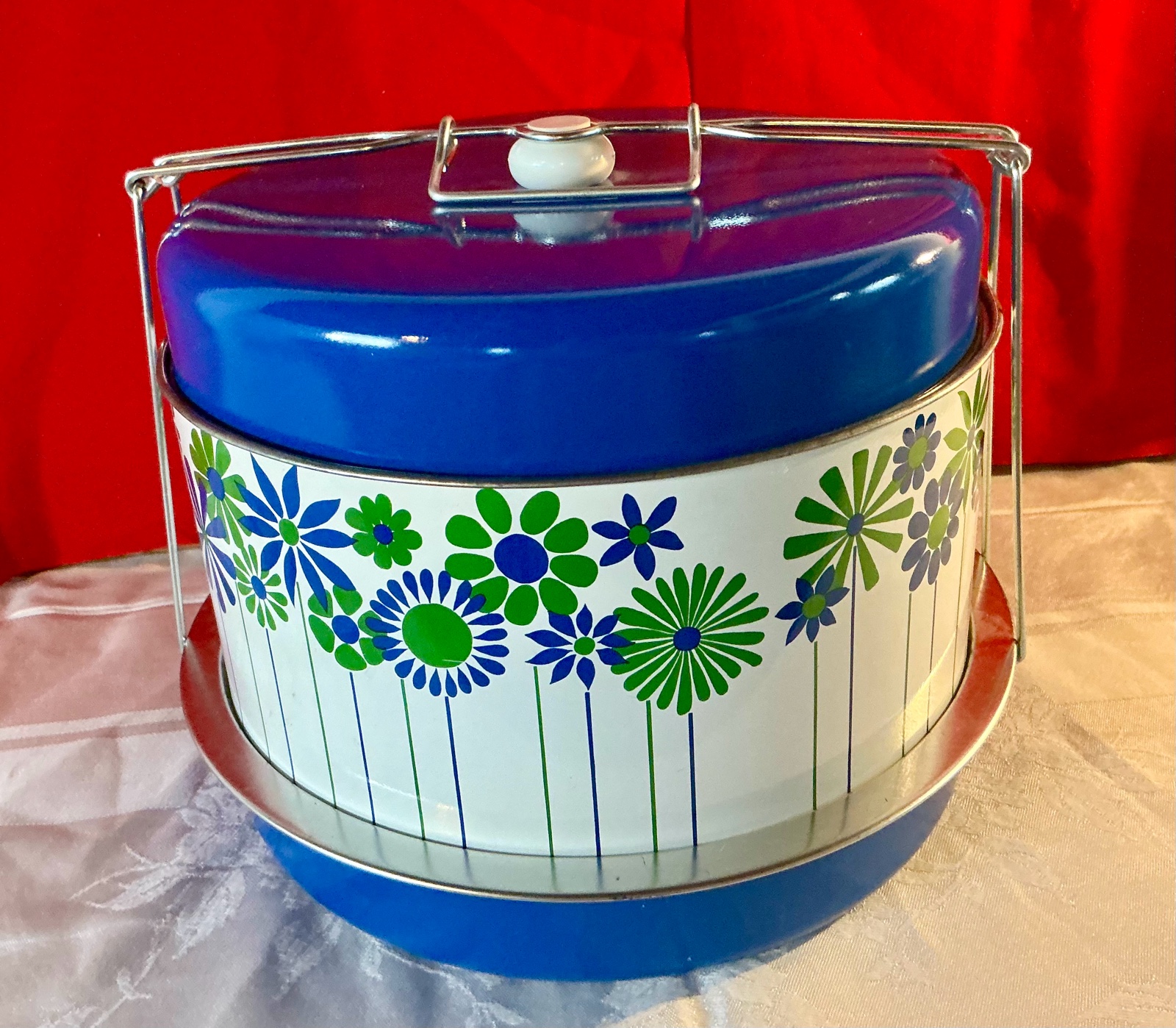 Vintage retro blue and white daisy tin cake container