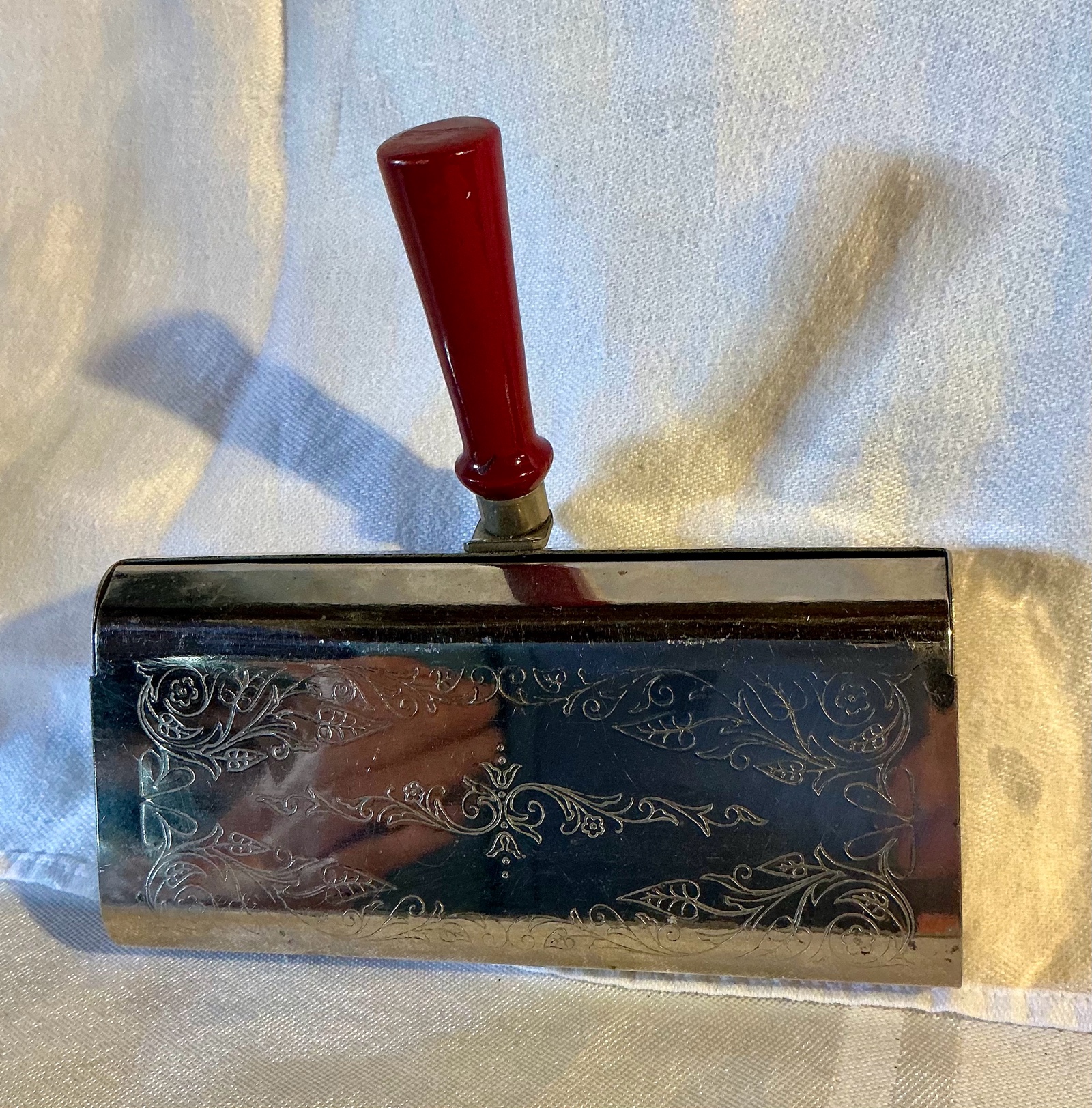 Vintage silver tone metal, wood handled crumb sweeper