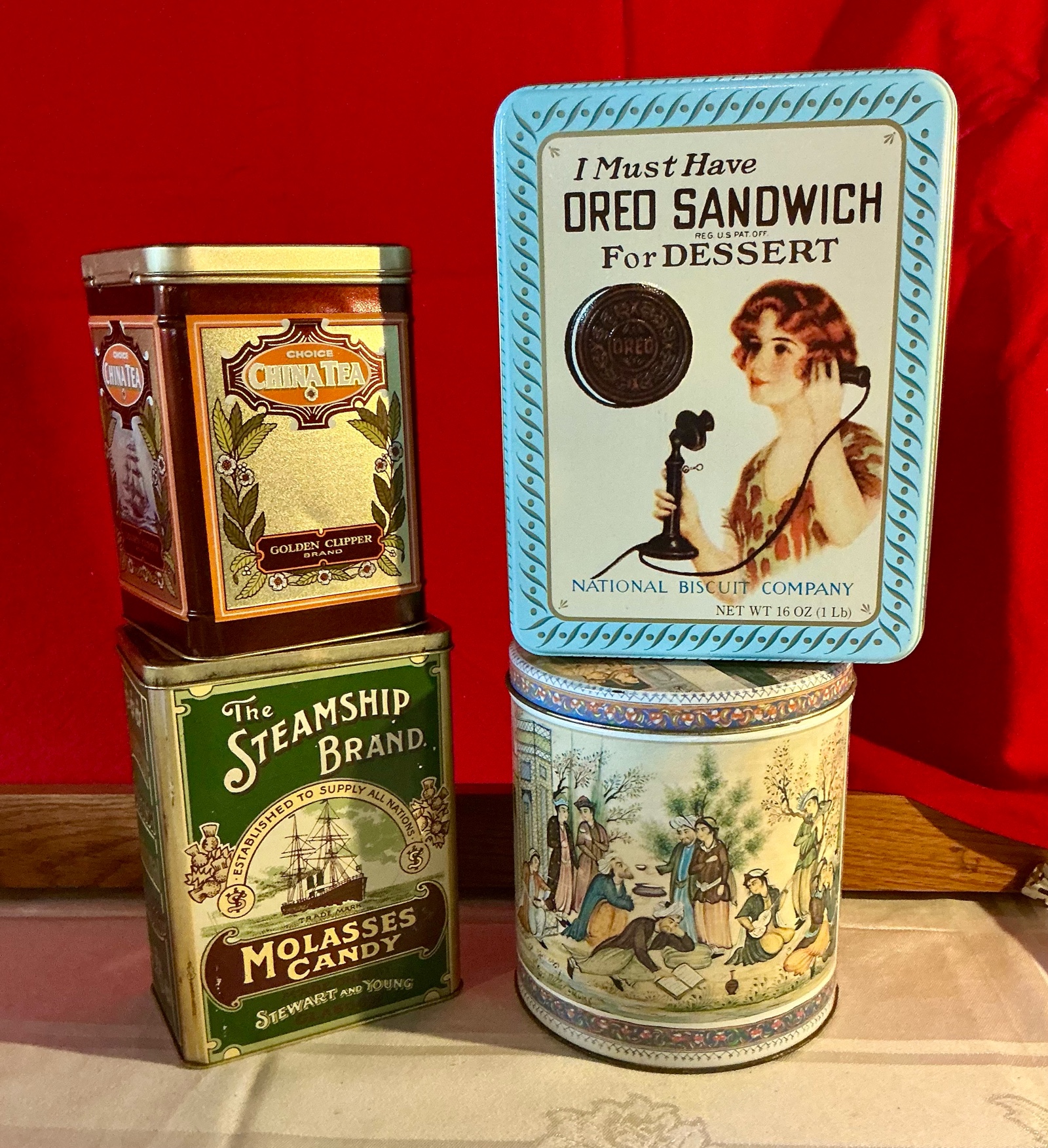 Group of 4 molasses candy, tea, cookie tins