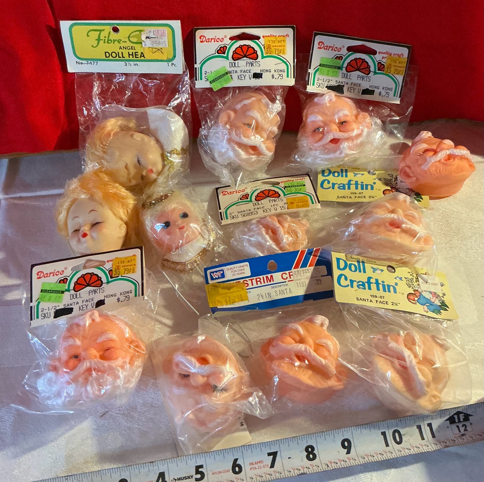 Group of 12 Darice & doll craft santas & angel heads