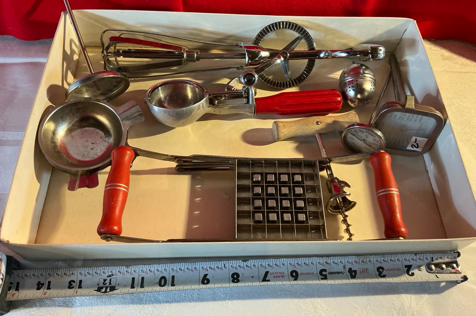 Vintage group of various kitchen utensil, red wood bakelite handled