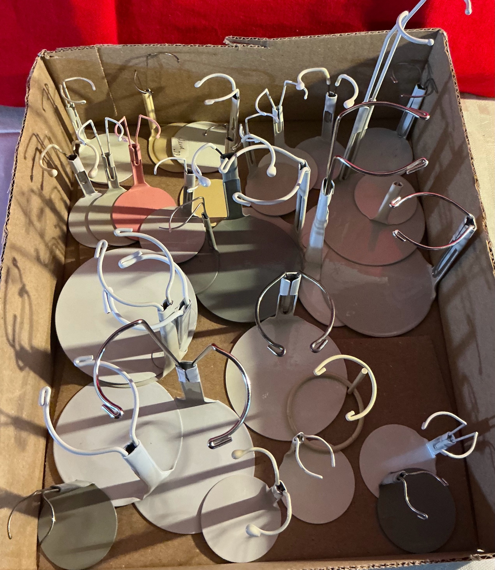 Large group of metal doll stands
