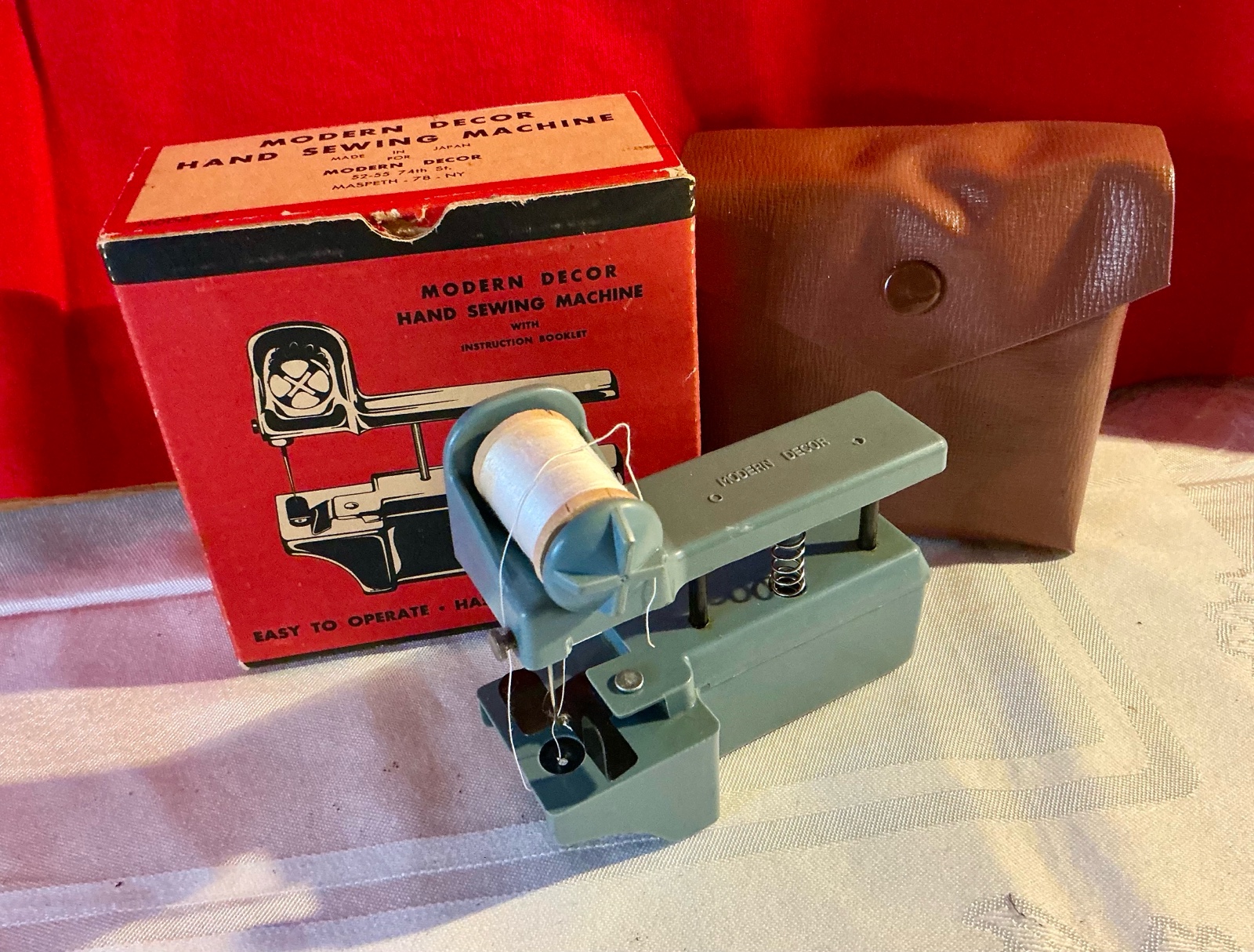 Vintage modern decor hand sewing machine with original container and box