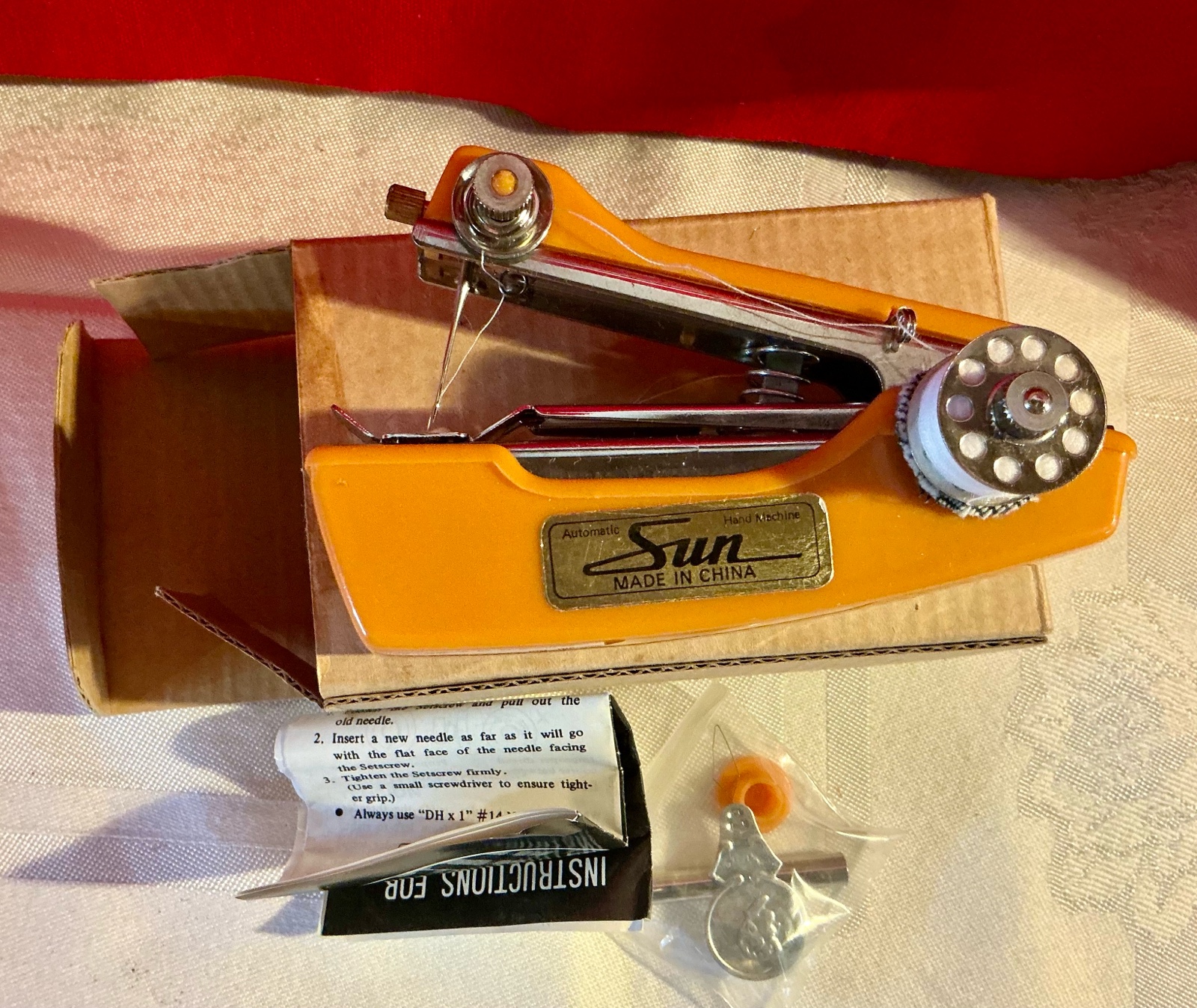 Vintage small hand held sun sewing machine in original box