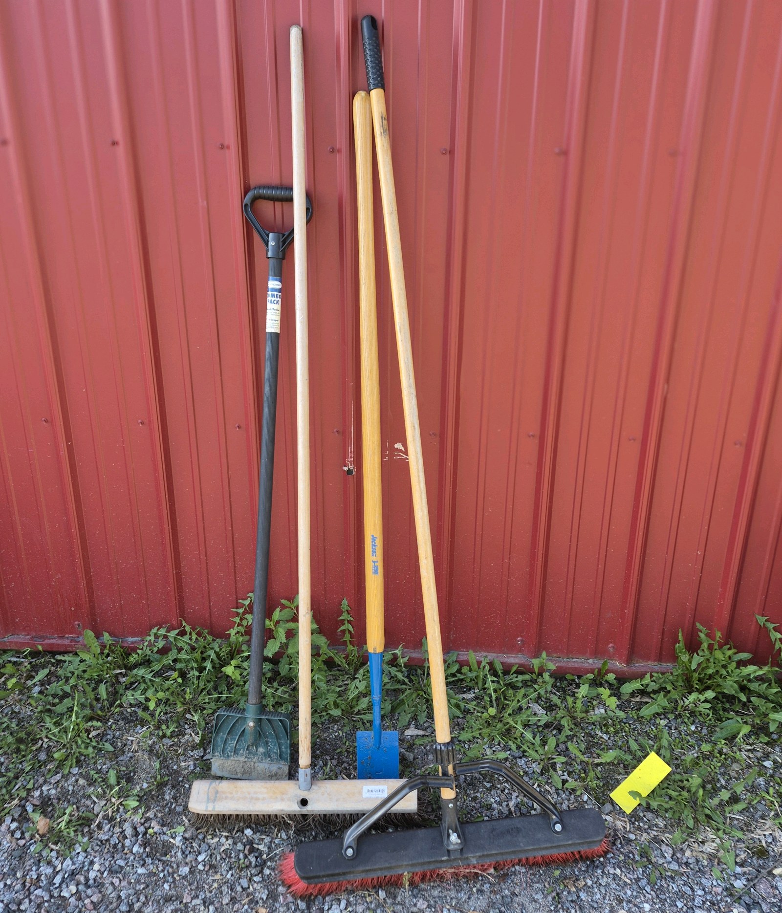 Lot of Assorted Brooms, Shovel, and Long Handle Yard Tools