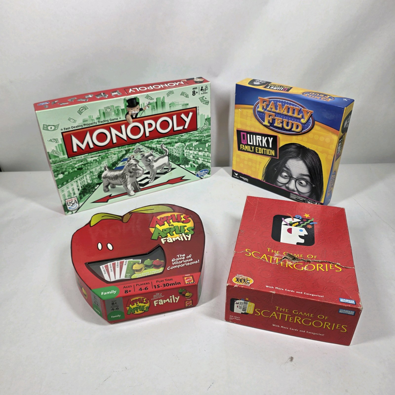 Lot of 4 Family Board Games Monopoly Family Feud Apples to Apples Scattergories