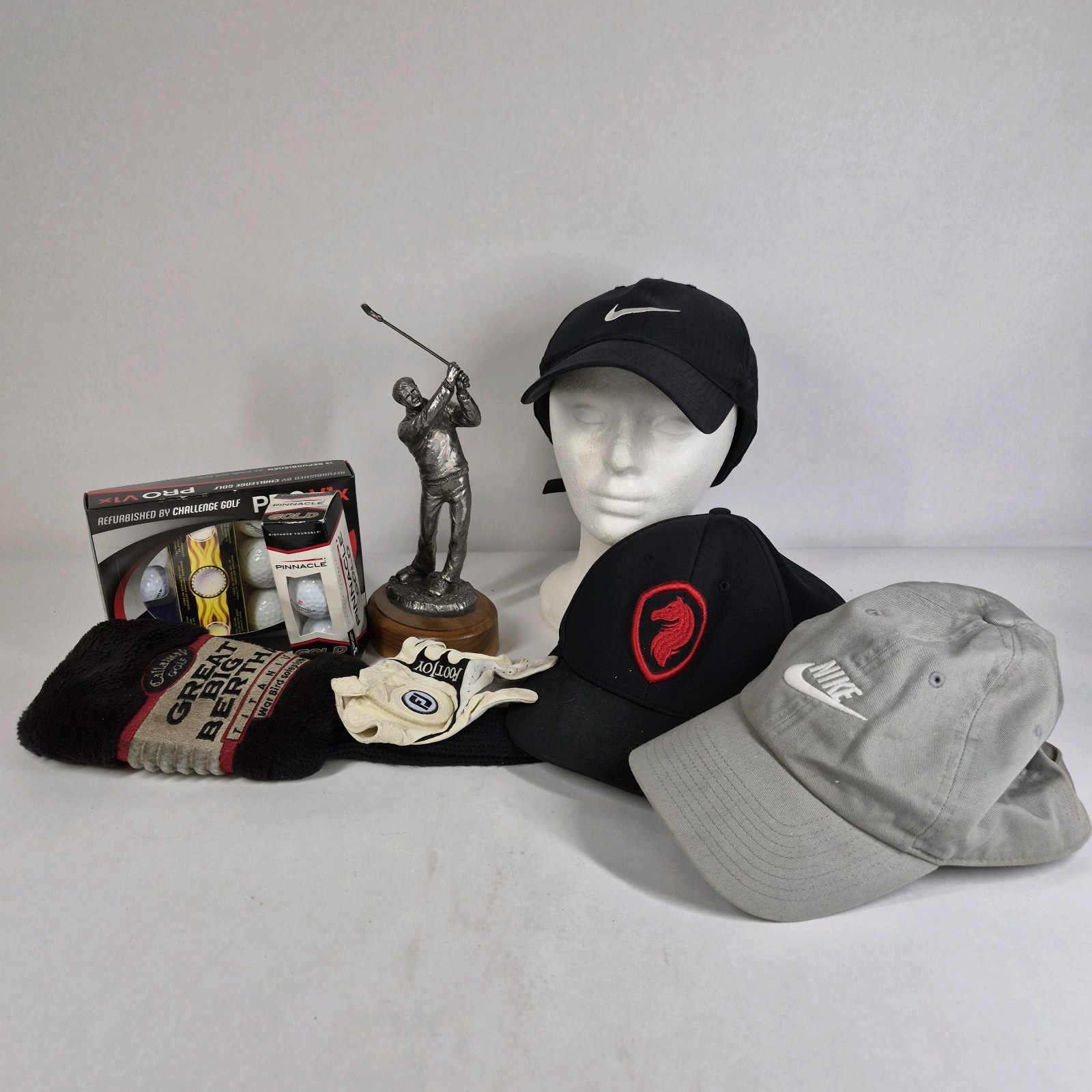 Lot of Nike Hats, Golf Balls, Gloves, Towel, and Golfer Trophy