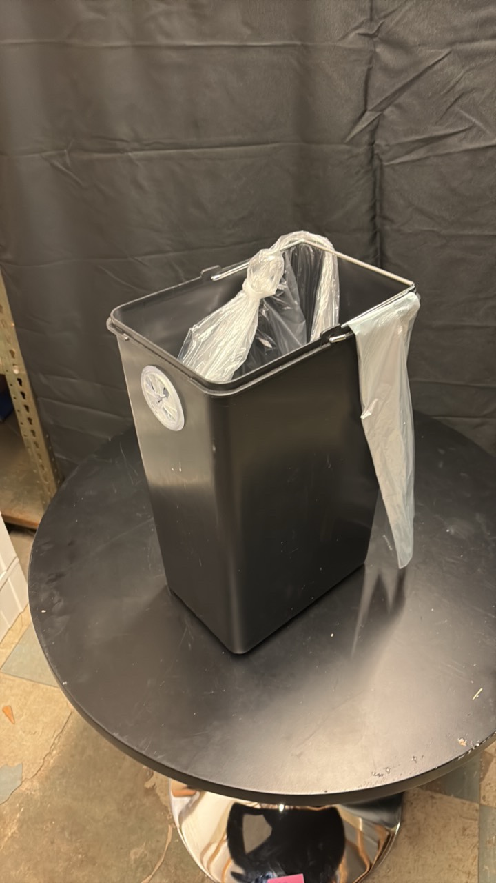 Black Plastic Garbage Bin With Roll of Trash Bags
