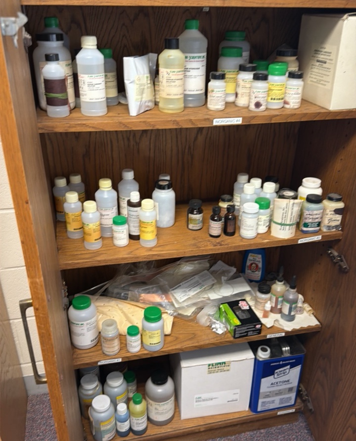 cabinet full of various solutions for science projects